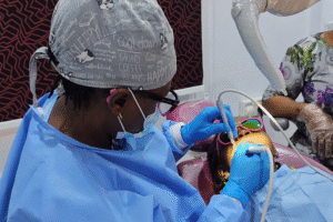 Patient receiving treatment at Klarity Dental - causes of tooth sensitivity